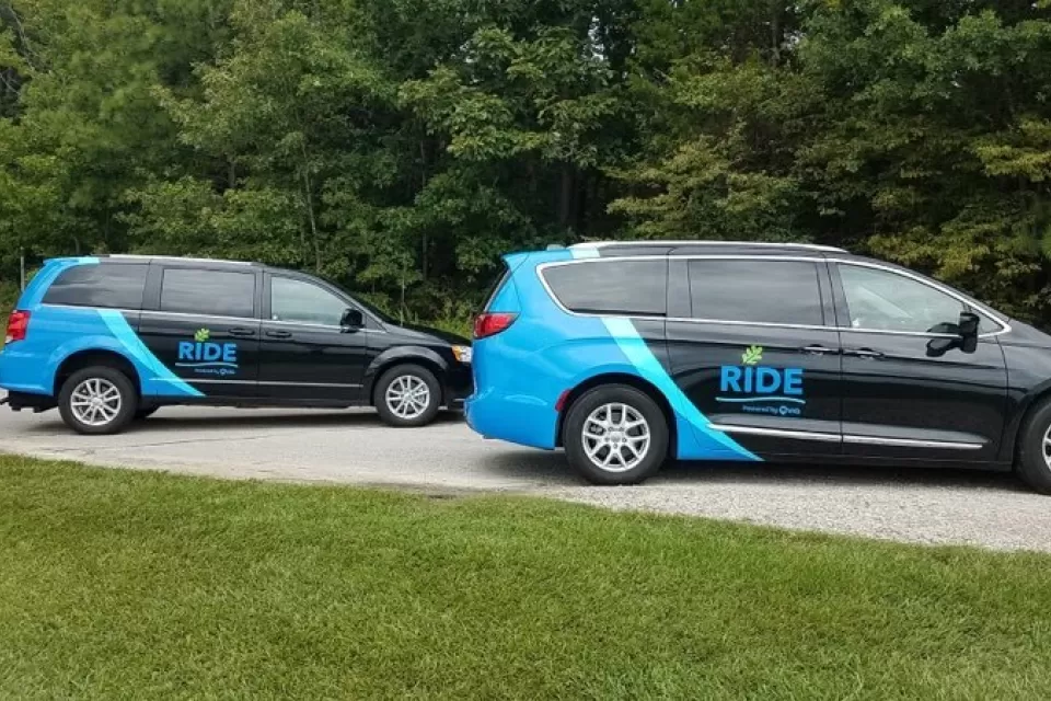 Two black and blue RIDE vans